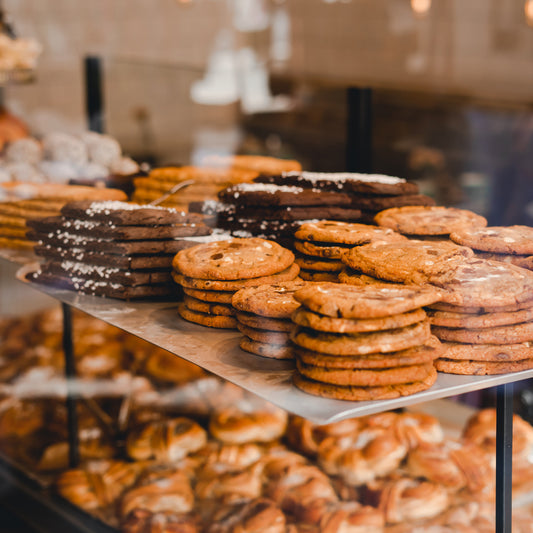 Elevate Your Style and Comfort with the IKAZZ Mid-Length Puffer Jacket with Fur Hood